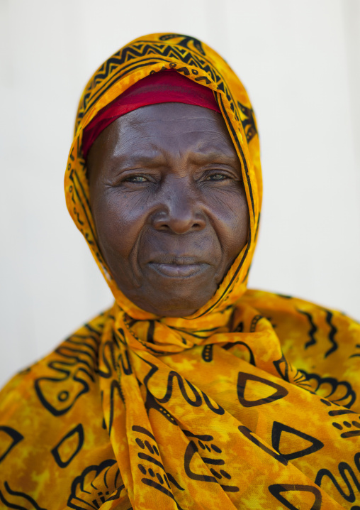 Swahili woman wearing yellow veil, Lamu County, Lamu, Kenya