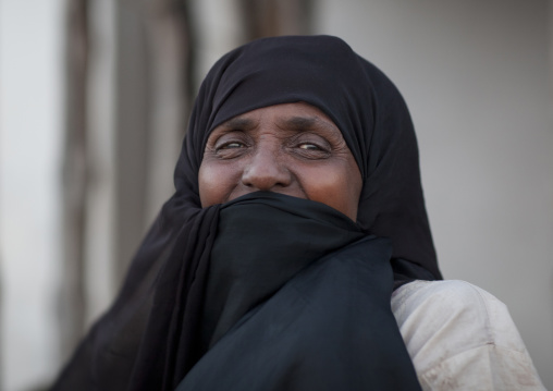 Senior muslim woman with mouth hidden by veil, Lamu County, Lamu, Kenya