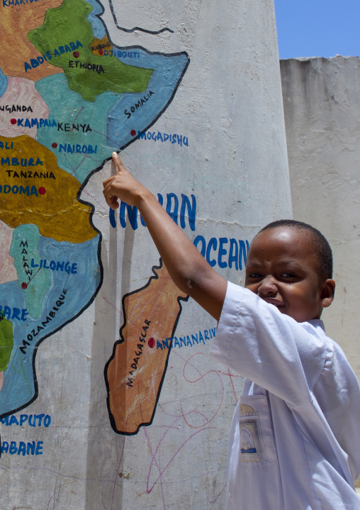Pupil showing Lamu on painted map at school, Lamu County, Lamu, Kenya