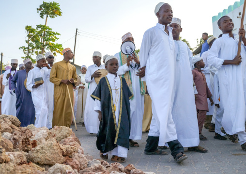 Sunni muslim people parading during the maulidi festivities in the street, Lamu county, Lamu town, Kenya