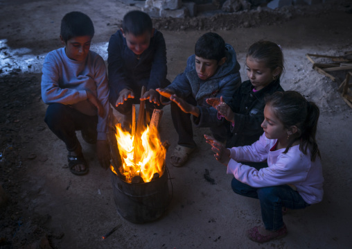 Yazidi Refugees Children Displaced From Sinjar Making Fire In An Under Construction Building, Duhok, Kurdistan, Iraq