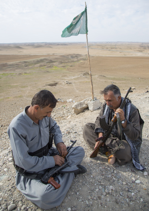 Kurdish Peshmergas Cleaning Their Kalashnikovs On The Frontline, Kirkuk, Kurdistan, Iraq