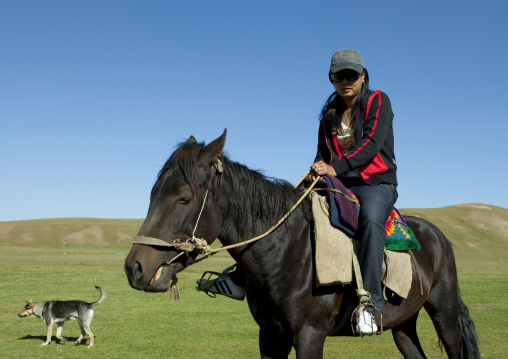 Woman With Sunglasses Riding A Horse, Jaman Echki Jailoo Village, Song Kol Lake Area, Kyrgyzstan