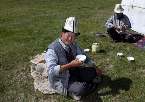 Men With Kalpak Hats Drinking Milk In Front Of A Yurt, Song Kol Lake, Kyrgyzstan
