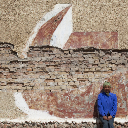 Woman Sitting On A Dilapidated Wall, Song Kol Lake Area, Kyrgyzstan