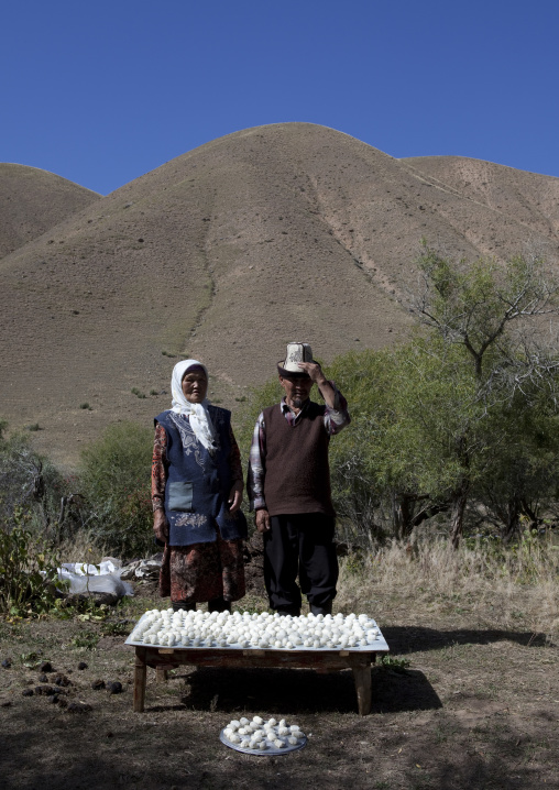 Old Couple Selling The Cheese They Make, Kyzart River, Kyrgyzstan