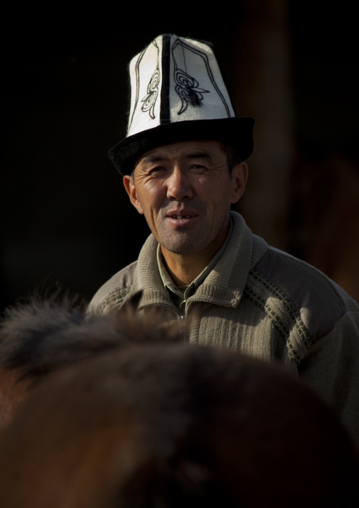 Man With A Kalpak Hat At The Animal Market Of Kochkor, Kyrgyzstan