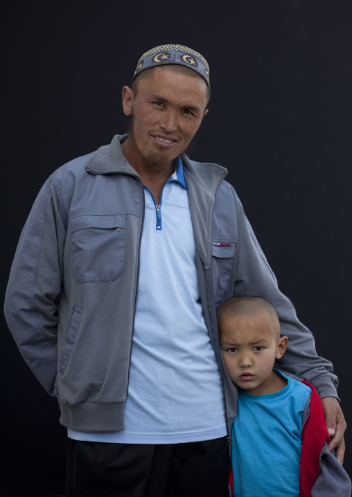 Father And Son At The Animal Market Of Kochkor, Kyrgyzstan