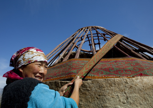 Woman With Headscarf Helping Putting Up A Yurt, Saralasaz Jailoo, Kyrgyzstan