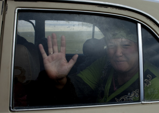 Woman Inside A Car Waving, Saralasaz Jailoo, Kyrgyzstan