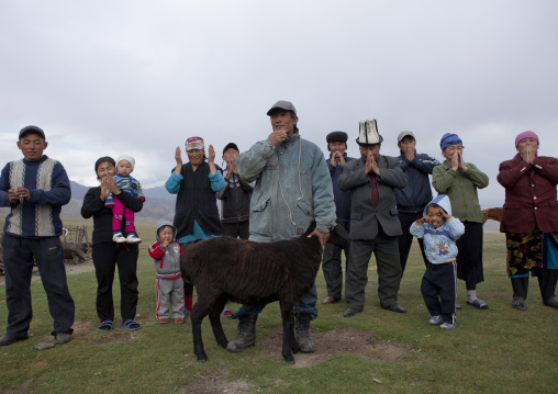 Family Blessing A Sheep Before Sacrifice, Saralasaz Jailoo Area, Kyrgyzstan