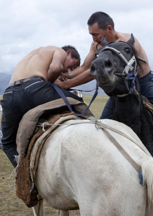 Men Doing Horse Wrestling In Saralasaz Jailoo, Kyrgyzstan