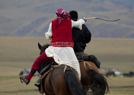 Man And Woman Playing Kyz Kuumai Horse Game, Saralasaz Jailoo, Kyrgyzstan