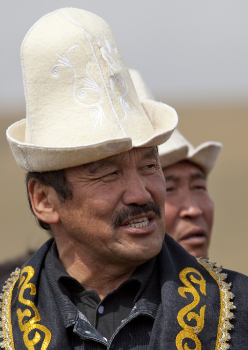 Men Wearing Kalpak Hats In Saralasaz Jailoo, Kyrgyzstan