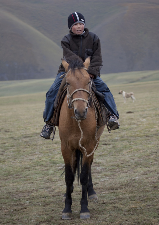 Young Boy With A Wooly Riding A Horse, Saralasaz Jailoo, Kyrgyzstan