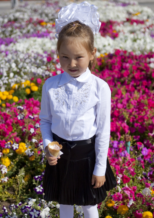 Girl With Ice Cream At Her First Day Of School, Bishkek, Kyrgyzstan