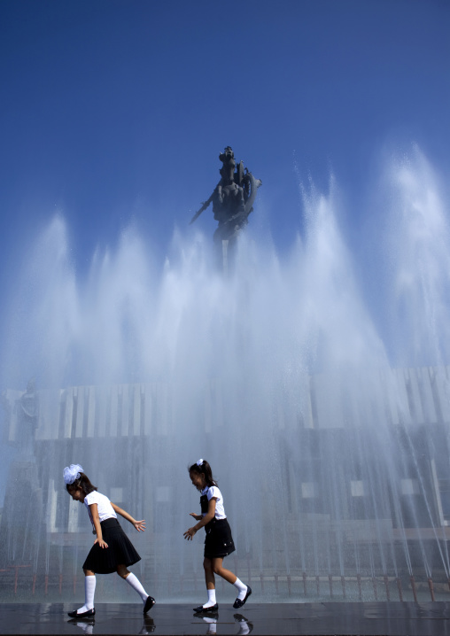 Girls In School Uniform Having Fun In A Fountain, Bishkek, Kyrgyzstan