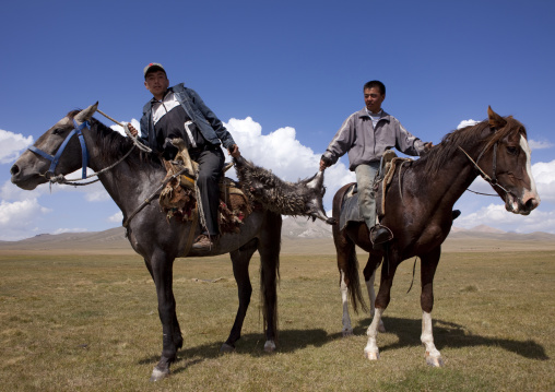 Horsemen Pulling On A Goat Skin During A Horse Game, Song Kol Lake Area, Kyrgyzstan