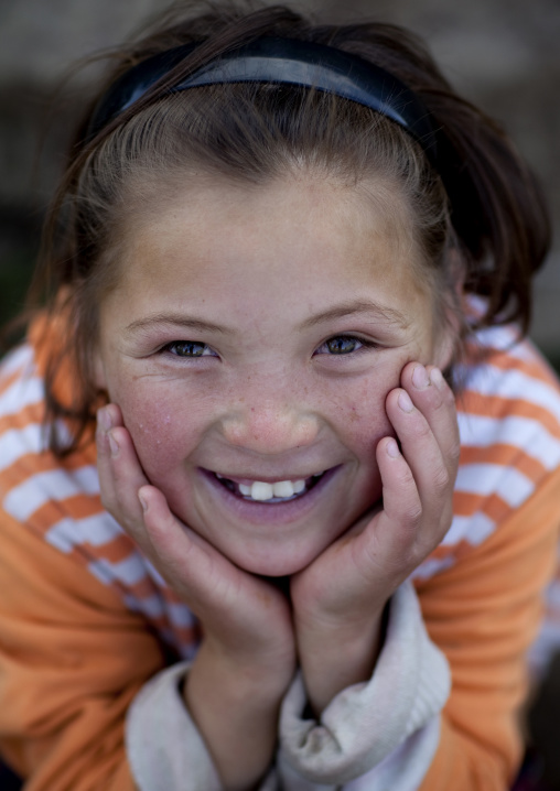 Young Girl Smiling In Jaman Echki Jailoo Village, Song Kol Lake Area, Kyrgyzstan