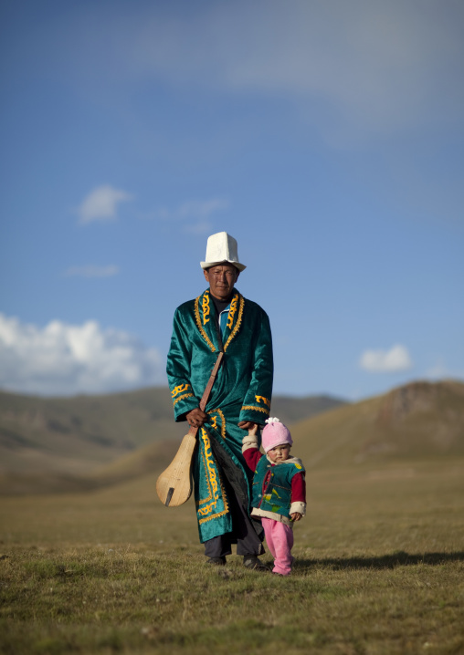 Father And Daughter In Traditional Clothes, Jaman Echki Jailoo Village, Song Kol Lake Area, Kyrgyzstan
