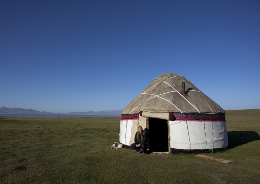 Man Sitting In Front Of A Yurt Near Song Kol Lake In Jaman Echki Jailoo Village, Kyrgyzstan