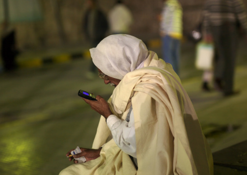 Old man reading texts on his mobile phone, Tripolitania, Tripoli, Libya