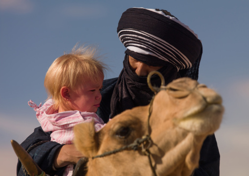 Portrait of a tuareg man with a blonde western girl, Tripolitania, Ghadames, Libya
