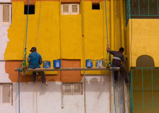 Men painting an Italian colonial building, Cyrenaica, Benghazi, Libya