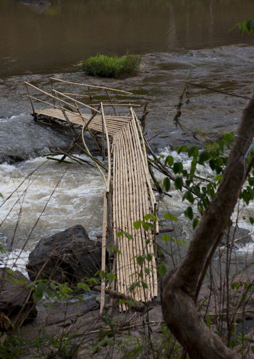 Wooden bridge in tadfan waterfalls, Boloven, Laos