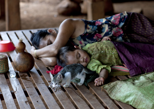 Bru minority mother and baby sleeping, Katou, Laos