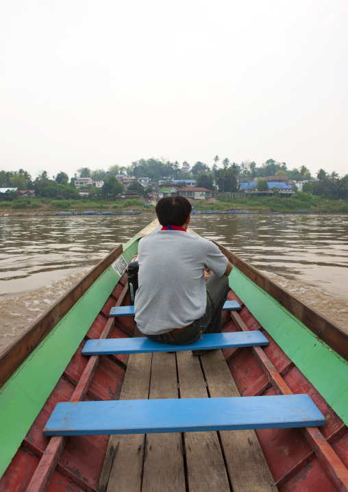 Man in a  speedboat on mekong river, Houei xay, Laos