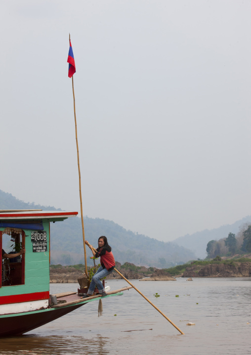 Woman on a boat on mekong river, Houei xay, Laos