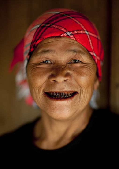Akha minority woman with black teeth, Muang sing, Laos