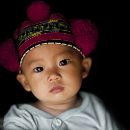 Yao minority kid with a traditional hat, Ban xay leck, Laos