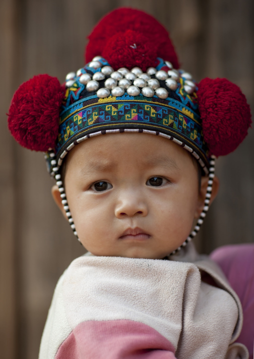 Yao minority kid with a traditional hat, Ban xay leck, Laos