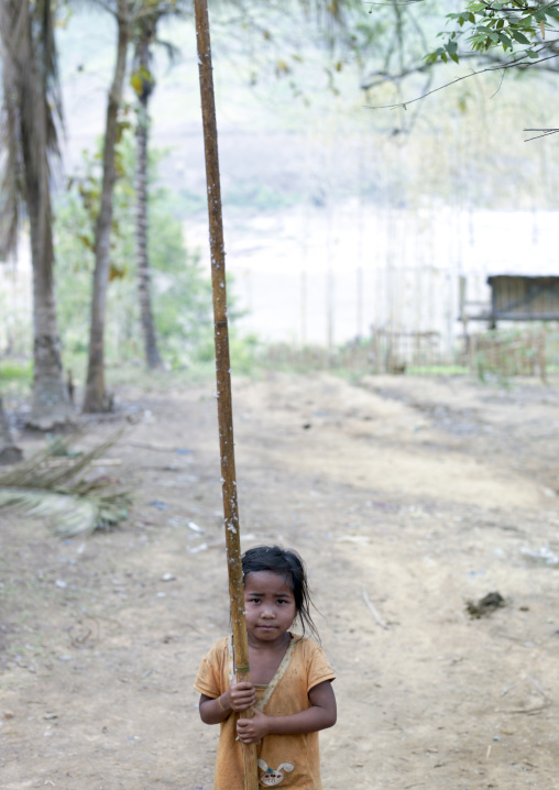 Khmu minority kid chasing insects with glue on a stick, Xieng khouang, Laos