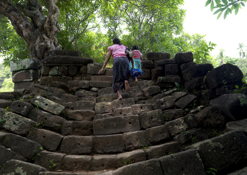 People climbing stairs at wat phu khmer temple, Champasak, Laos