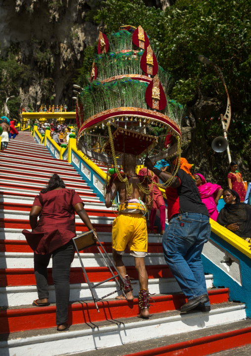 Devotee Kavadi Bearer Climbing Stairs At Thaipusam Hindu Religious Festival In Batu Caves, Southeast Asia, Kuala Lumpur, Malaysia