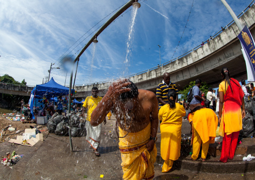 Hindu Pilgrim Taking Shower In Annual Thaipusam Religious Festival In Batu Caves, Southeast Asia, Kuala Lumpur, Malaysia