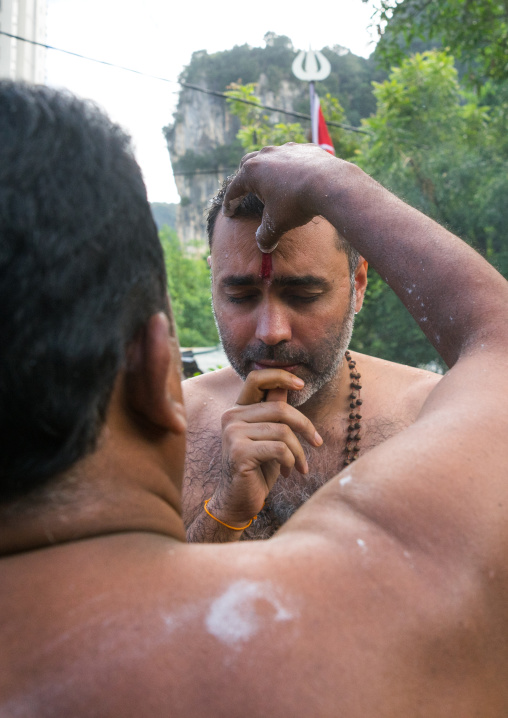 Hindu Priest Blessing A Devotee In Annual Thaipusam Religious Festival In Batu Caves, Southeast Asia, Kuala Lumpur, Malaysia