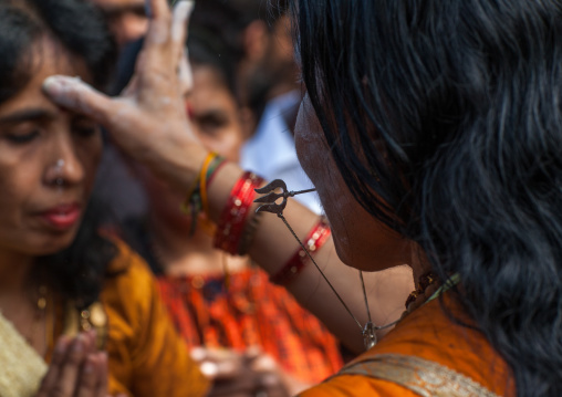 Hindu Woman Blessing A Devotee In Annual Thaipusam Religious Festival In Batu Caves, Southeast Asia, Kuala Lumpur, Malaysia