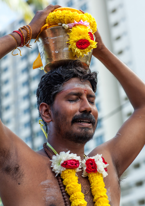 Hindu Devotee Man Carrying Water Jug On His Head In Annual Thaipusam Religious Festival In Batu Caves, Southeast Asia, Kuala Lumpur, Malaysia
