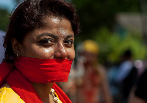 Hindu Devotee With Her Mouth Gagged To Keep Silence In Annual Thaipusam Religious Festival In Batu Caves, Southeast Asia, Kuala Lumpur, Malaysia