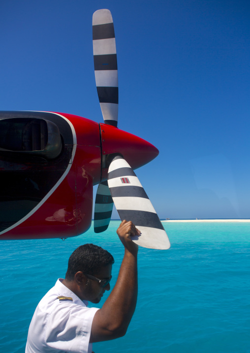 Maldivian Air Taxi Seaplane Pilot, Baa Atoll, Maldives