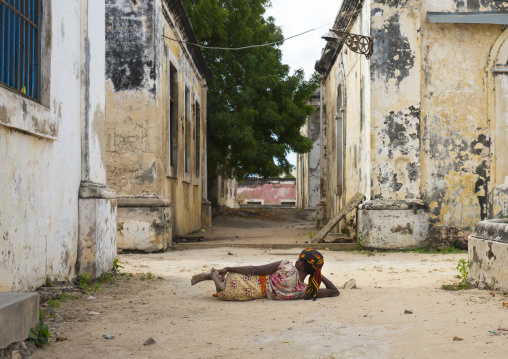 Woman Lying On The Ground Inside The Old Hospital, Ilha de Mocambique, Nampula Province, Mozambique