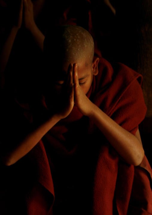 Novice Buddhist Monk Praying, Rangoon, Myanmar