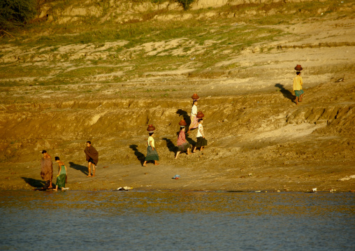 Women Collecting Water On Irrawaddy River Banks, Myanmar
