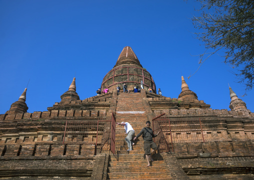 Tourist Climbing On An Old Temple, Bagan, Myanmar
