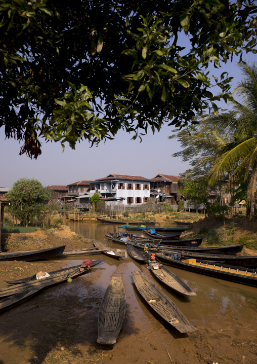 Boats On Banks In Front Of A Huge House, Inle Lake, Myanmar