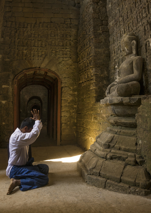Man Praying Inside Kothaung Temple, Mrauk U, Myanmar